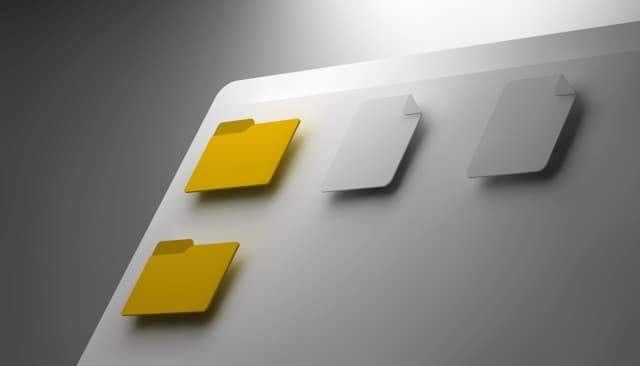 a white wall with a yellow piece of paper on it
